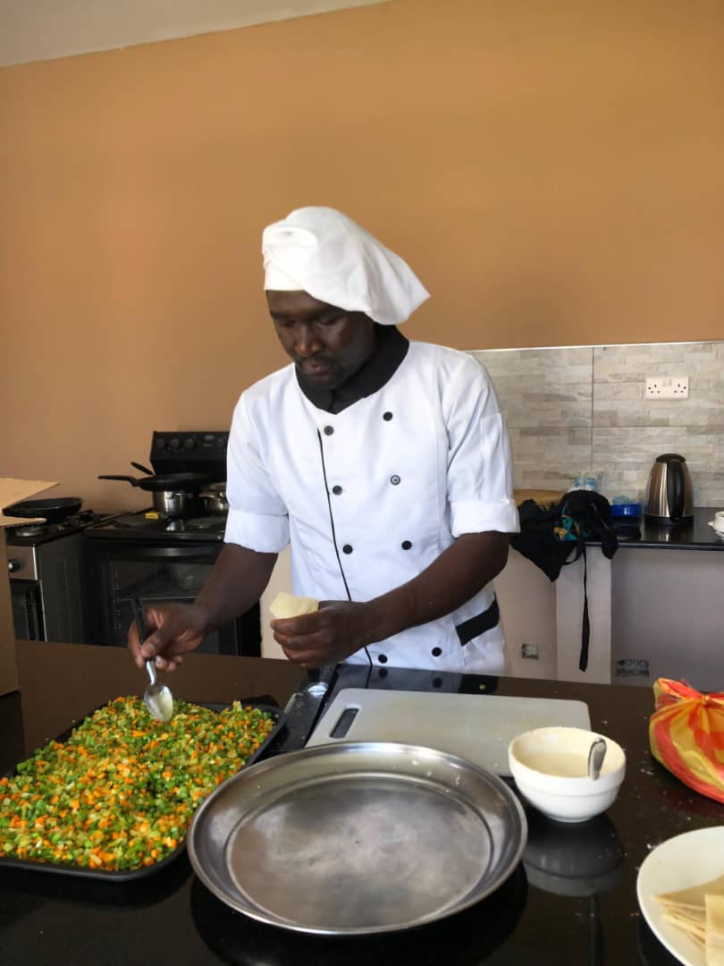 William cooking in chef whites