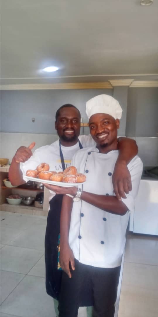 William and colleague with fresh doughnuts